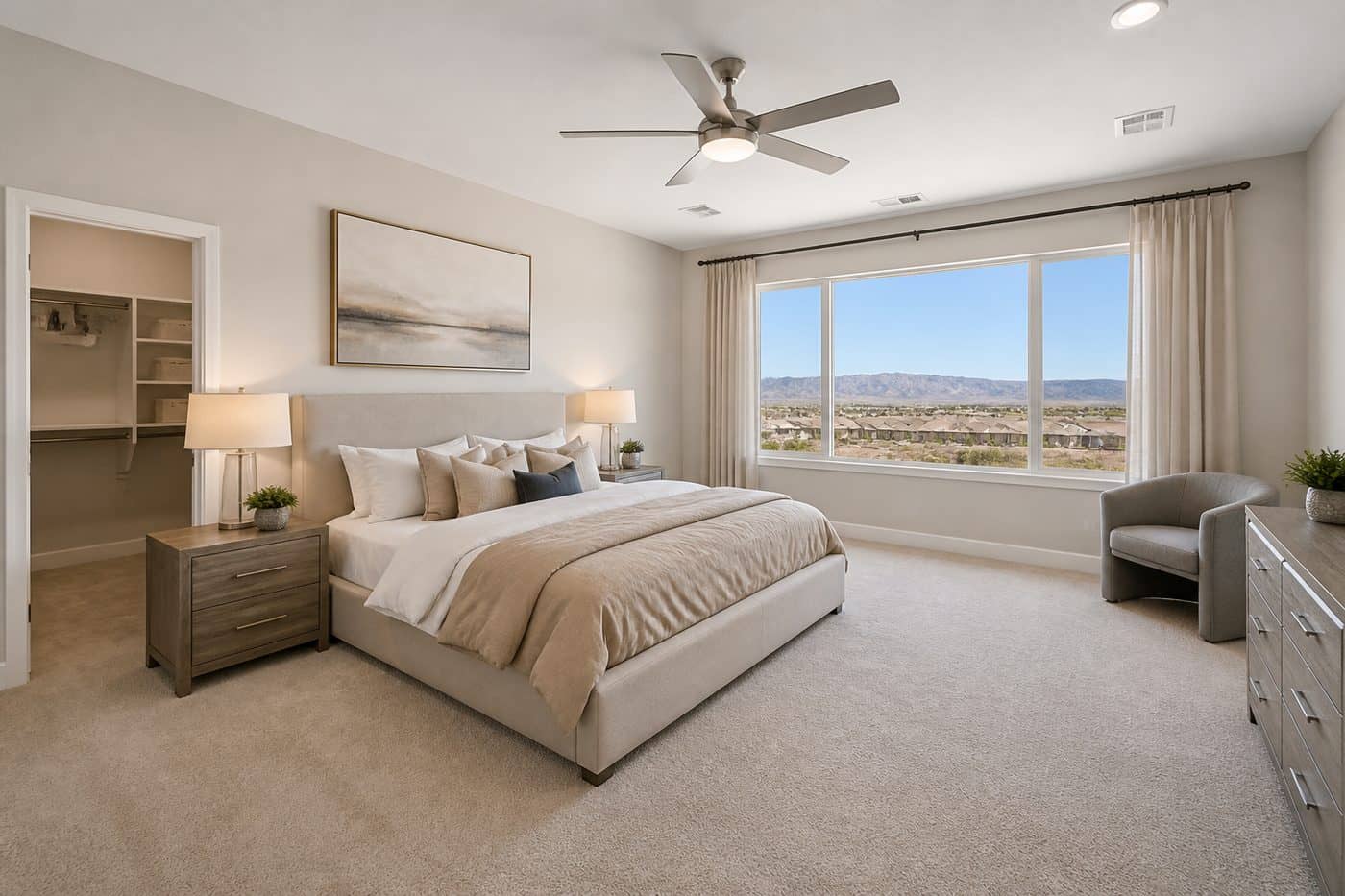 Primary bedroom with mountain-view windows at Terra at Skyeview by Century Communities