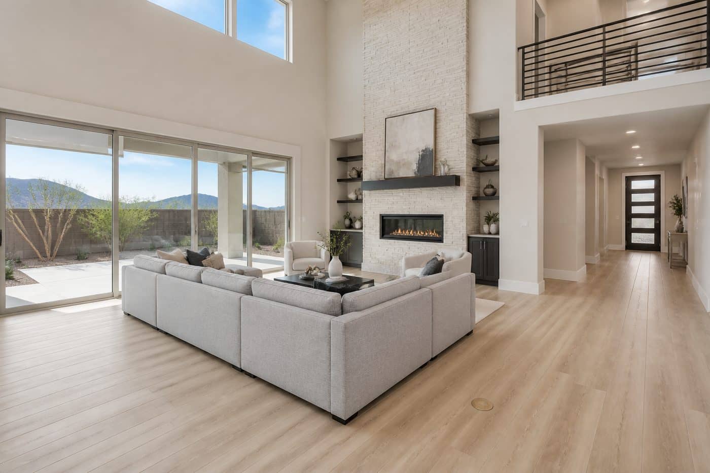 Open living room with vaulted ceiling at a Terra at Skyeview new home in Skye Canyon
